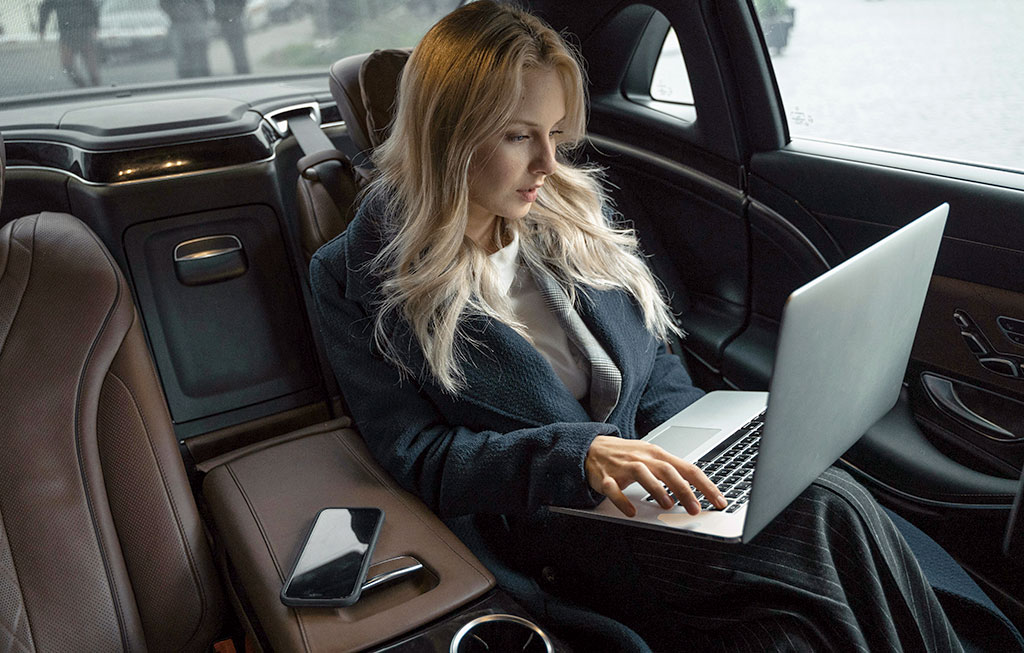 female executive in a luxury car