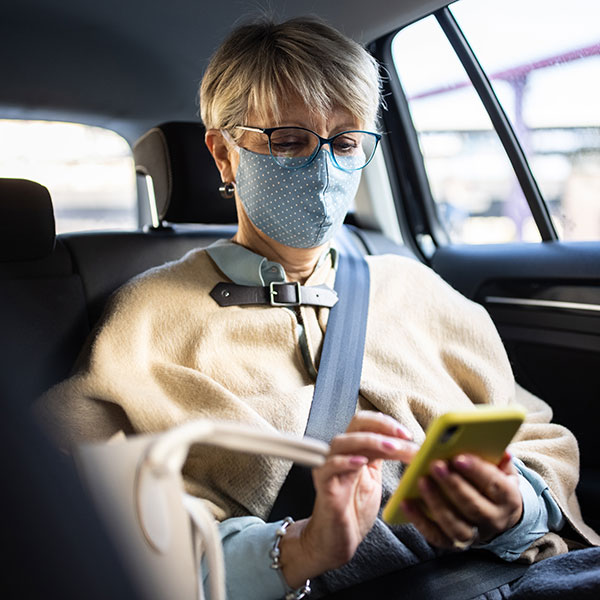ill lady travelling to clinic via luxury car