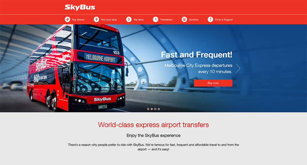 A red SkyBus express airport transfer bus.