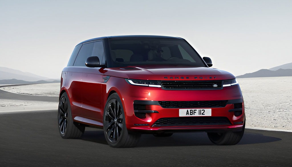 A luxurious Range Rover driving through a scenic, mountainous landscape.